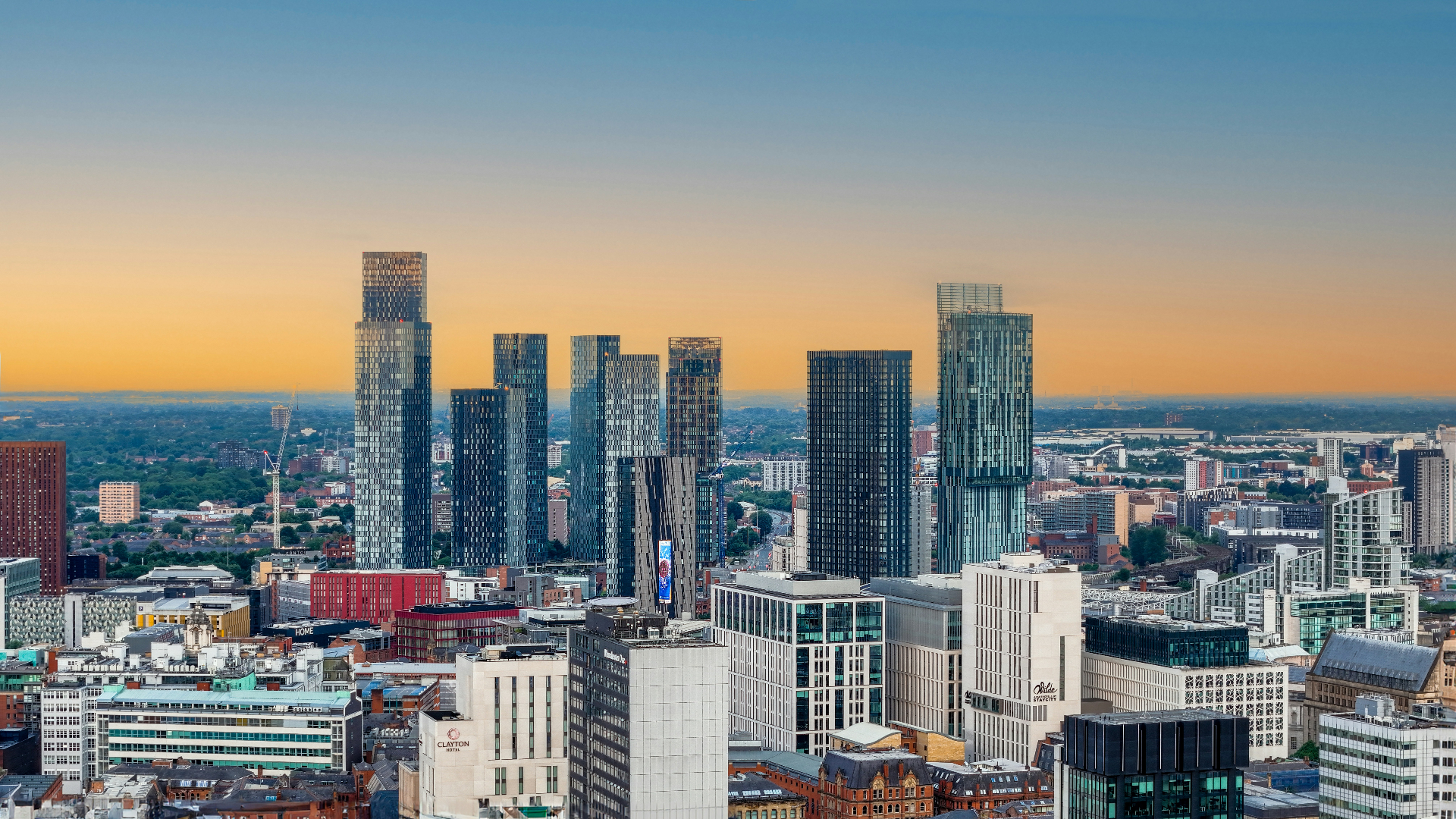 Manchester city skyline at sunset with Deansgate towers and Beetham Tower